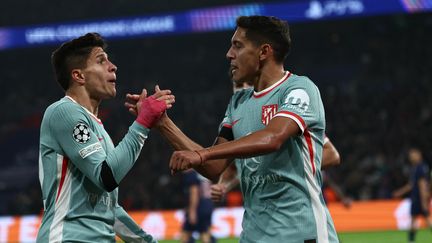 Nahuel Molina célèbre son but face au PSG en Ligue des champions, le 6 novembre 2024. (ANNE-CHRISTINE POUJOULAT / AFP)