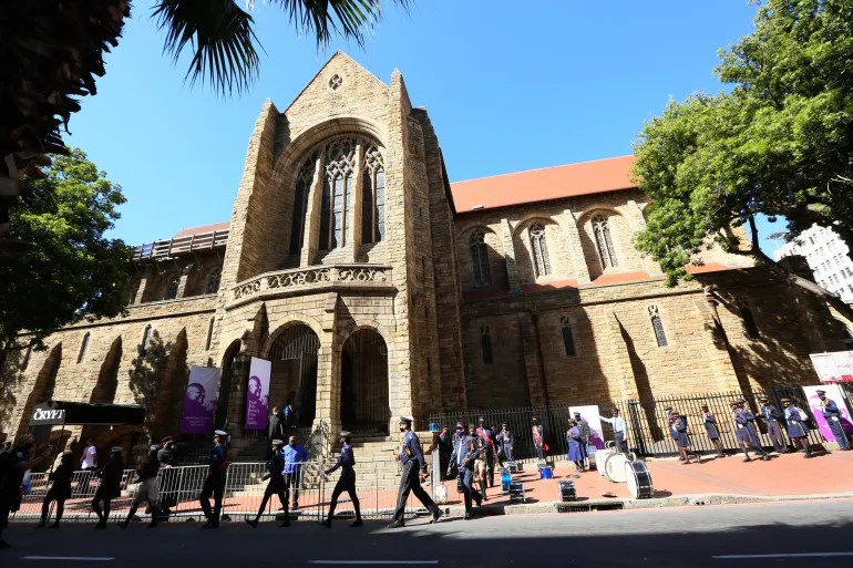 People queue to pay their respects to the late Anglican Archbishop Emeritus Desmond Tutu at St George’s Cathedral, in December 2021